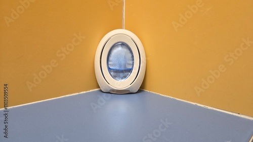 air freshener in a colorful bathroom with yellow and blue tiles