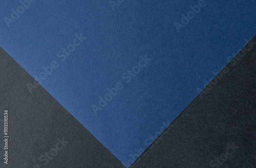 Dark blue and black colored paper background texture, Two tones, Concept for image, text, design. Geometric paper backdrop..