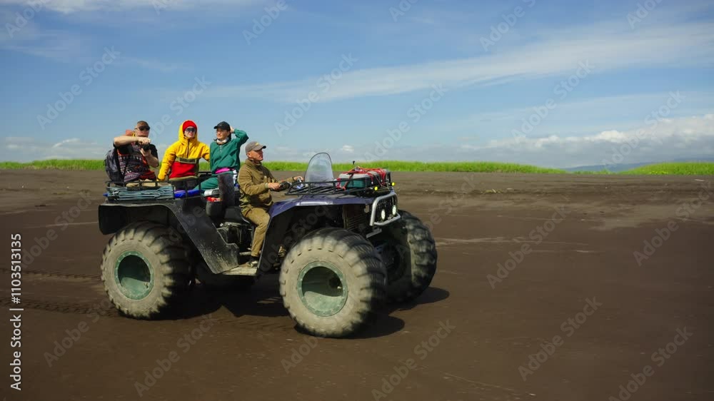 Male And Female Travelers Traveling By Monster Quad In Beautiful Nature, Expedition Male And Female Travelers Traveling By Monster Quad In Beautiful Nature, Expedition