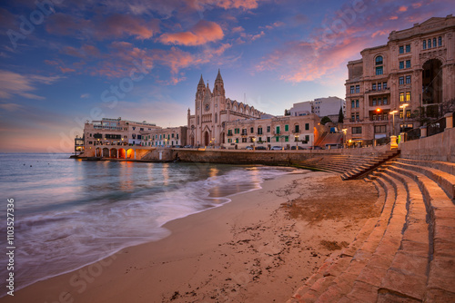 St. Julian's, Malta. Cityscape image of seaside town St. Julian's, Malta at beautiful sunrise.