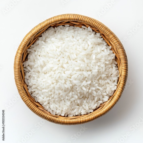 Traditional Woven Basket Filled with Abundant White Rice Against a Neutral Background