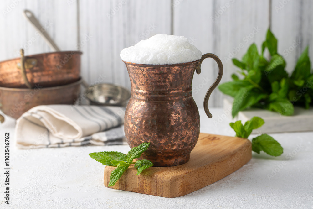 Ayran - Traditional Turkish yoghurt drink in a copper cup