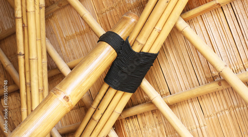 Traditional bamboo roofing structure joints and fibre rope joinery detail.