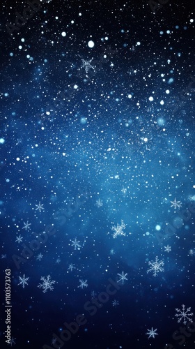 Snowflakes falling gently in a winter night sky filled with twinkling stars and various shades of blue