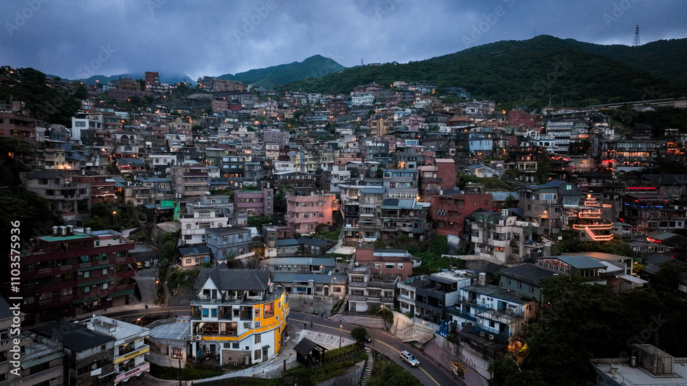Fototapeta premium A panoramic view of Jiufens charming hillside homes under a twilight sky
