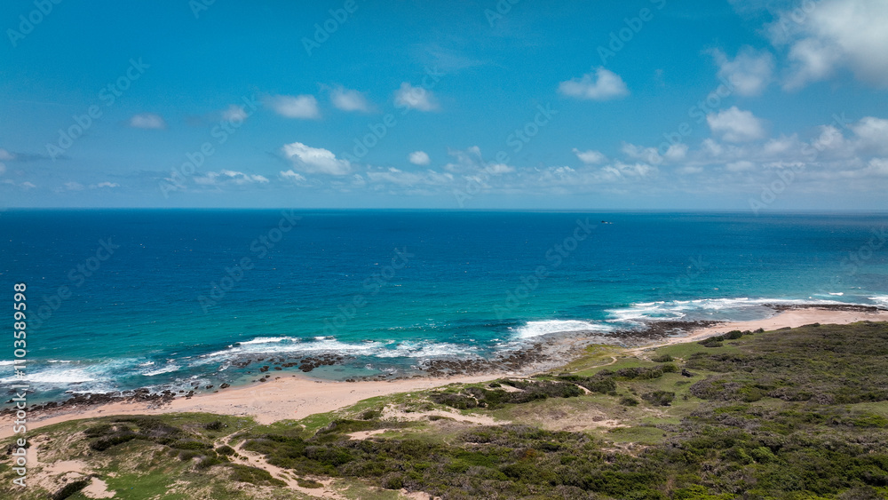 Breathtaking coastal view from Longpan Park showing the vibrant blue ocean and sandy beach Breathtaking coastal view from Longpan Park showing the vibrant blue ocean and sandy beach
