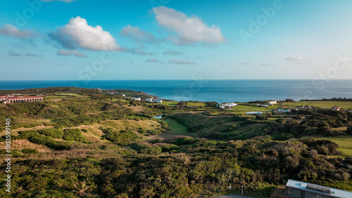 Stunning coastal view of lush hills and blue ocean in Taiwan during a clear daytime sky