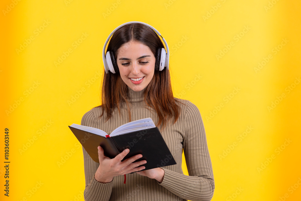 A cheerful young woman wearing white headphones and holding an open book, standing against a vibrant yellow background. Perfect image for learning, audiobooks, or educational themes. A cheerful young woman wearing white headphones and holding an open book, standing against a vibrant yellow background. Perfect image for learning, audiobooks, or educational themes.