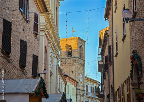 View of the old street of Mombaroccio village with traditional christmas market in the Marche region hills, Italy photo