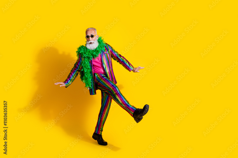 Photo of cheerful good mood man wear trendy bright clothes walk theme party isolated on yellow color background Photo of cheerful good mood man wear trendy bright clothes walk theme party isolated on yellow color background