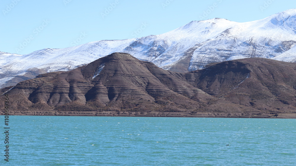 Tislit Lake in Imilchil, Morocco's Haut Atlas Oriental National Park, surrounded by snow-capped mountains, rugged terrain, and serene blue waters, perfect for nature, hiking, and scenic photography.
Tislit Lake in Imilchil, Morocco's Haut Atlas Oriental National Park, surrounded by snow-capped mountains, rugged terrain, and serene blue waters, perfect for nature, hiking, and scenic photography.