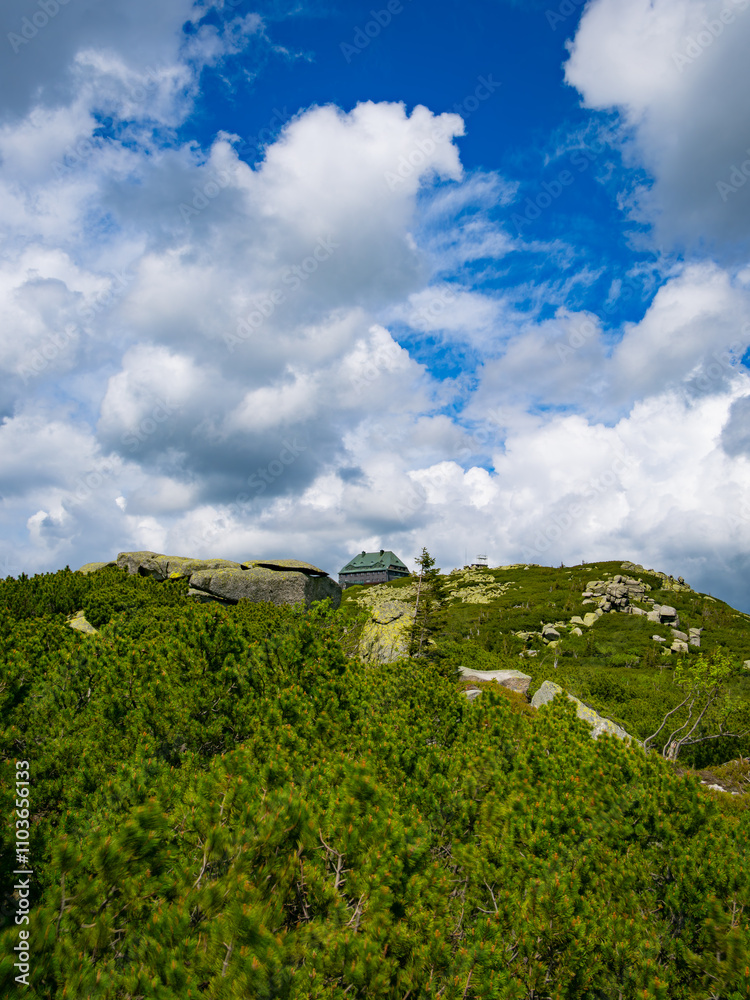 Obraz premium 2024-05-20; View of a mountain hut on top of Mount Szrenica in the Karkonosze Mountains