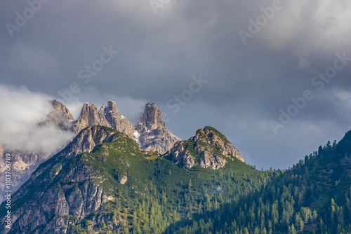 Dolomites mountains nasty weather in autumn with dark cloudy sky before the storm. Black clouds on the sky above the mountain rocky summits and peaks, stormy weather in the Dolomiti Alps, Italy. Extre photo