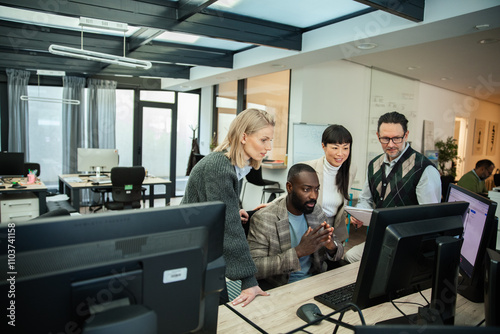 Diverse business people working together on office computer