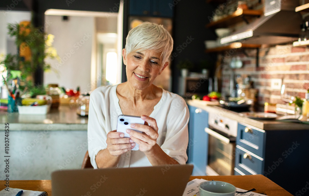 Senior woman working from home on a laptop Senior woman working from home on a laptop