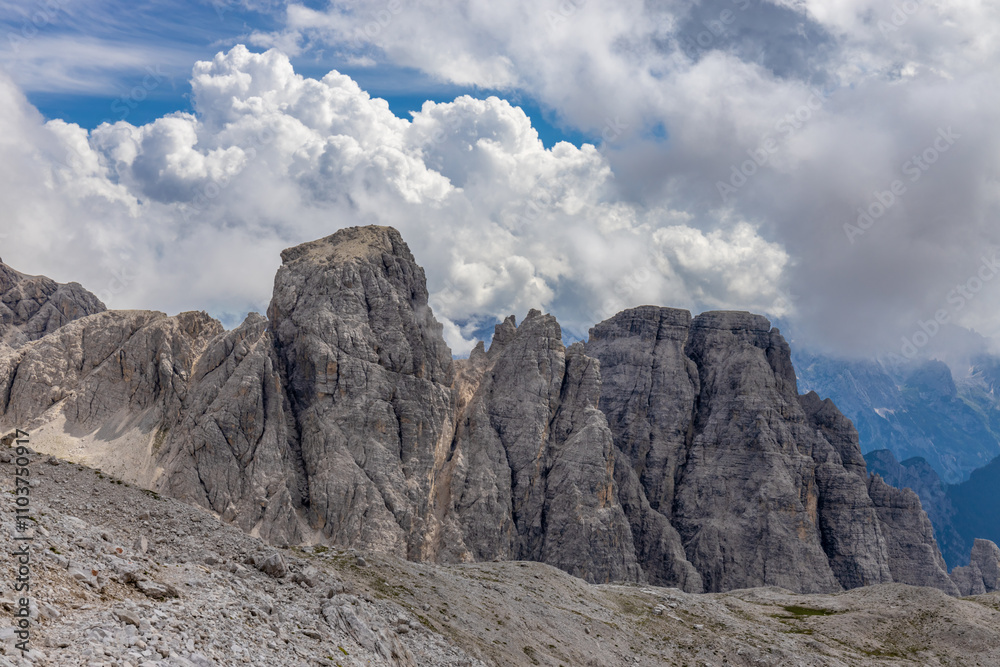 Dolomites mountains nasty weather in autumn with dark cloudy sky before the storm. Black clouds on the sky above the mountain rocky summits and peaks, stormy weather in the Dolomiti Alps, Italy Dolomites mountains nasty weather in autumn with dark cloudy sky before the storm. Black clouds on the sky above the mountain rocky summits and peaks, stormy weather in the Dolomiti Alps, Italy