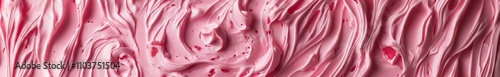 A smooth, swirled texture in shades of pink, resembling a creamy substance or dessert.