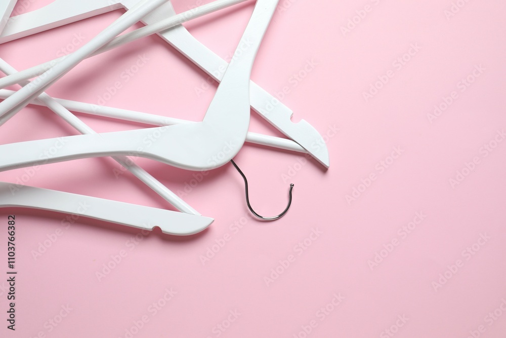 Wooden clothes hanger on a colored background Wooden clothes hanger on a colored background