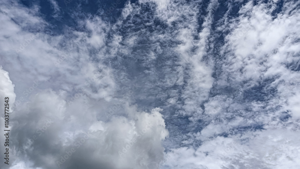 A breathtaking capture of a sky filled with soft, textured clouds stretching across a serene atmosphere. A breathtaking capture of a sky filled with soft, textured clouds stretching across a serene atmosphere.