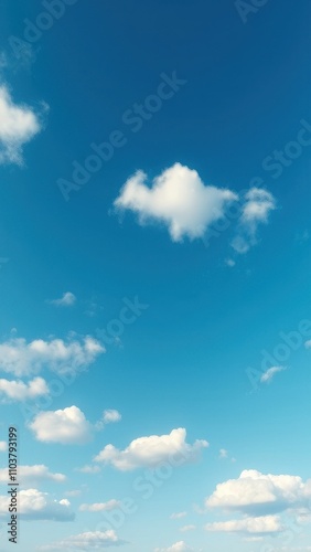 A serene blue sky with a few white clouds scattered across it in a random and natural formation, sky, weather, serene, vastness