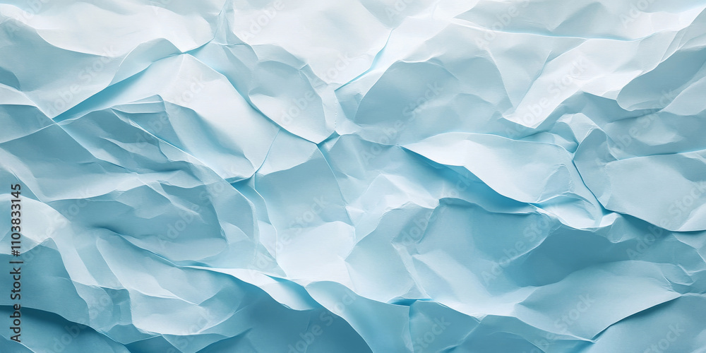 Obraz premium Icy blue crumpled paper texture with frosty shades. Subtle folds and creases evoke a cool and textured feel.