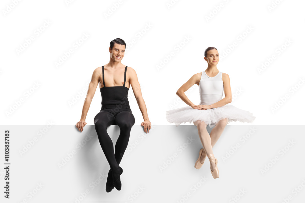 Naklejka premium Full length shot of a male and female ballet dancers sitting on a blank panel