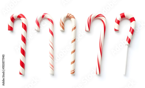 Classic red and white striped candy cane adorned with holly leaves, red berries, and a festive ribbon, perfect for Christmas decor. Christmas candy cane decoration. Candy cane with bow