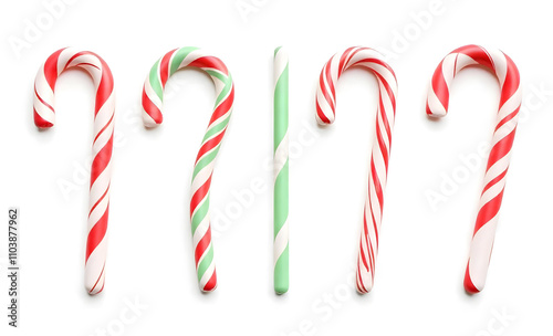 Classic red and white striped candy cane adorned with holly leaves, red berries, and a festive ribbon, perfect for Christmas decor. Christmas candy cane decoration. Candy cane with bow
