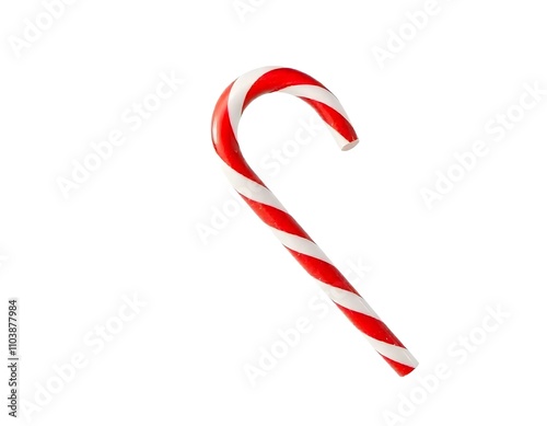 Classic red and white striped candy cane adorned with holly leaves, red berries, and a festive ribbon, perfect for Christmas decor. Christmas candy cane decoration. Candy cane with bow