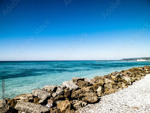 Breakwater on beach in Vada, Italy.