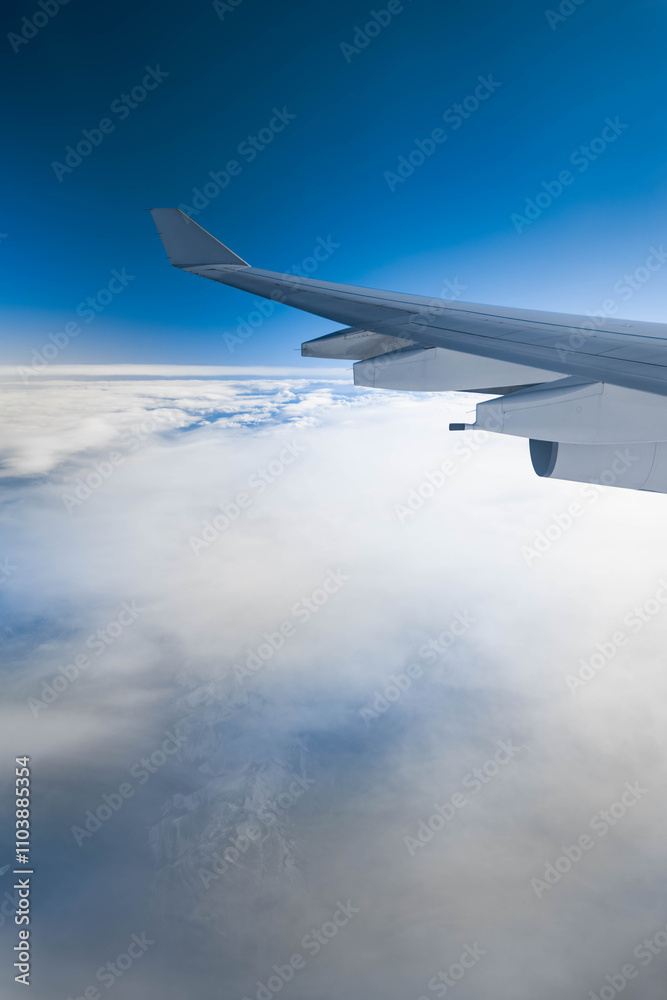 View of snow covered Greenland from an airplane window View of snow covered Greenland from an airplane window