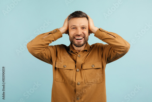 Wow. Excited Wow. Excited african american guy holding hands on head, looking at camera with amazement, yellow studio background guy holding hands on head, looking at camera with amazement, blue