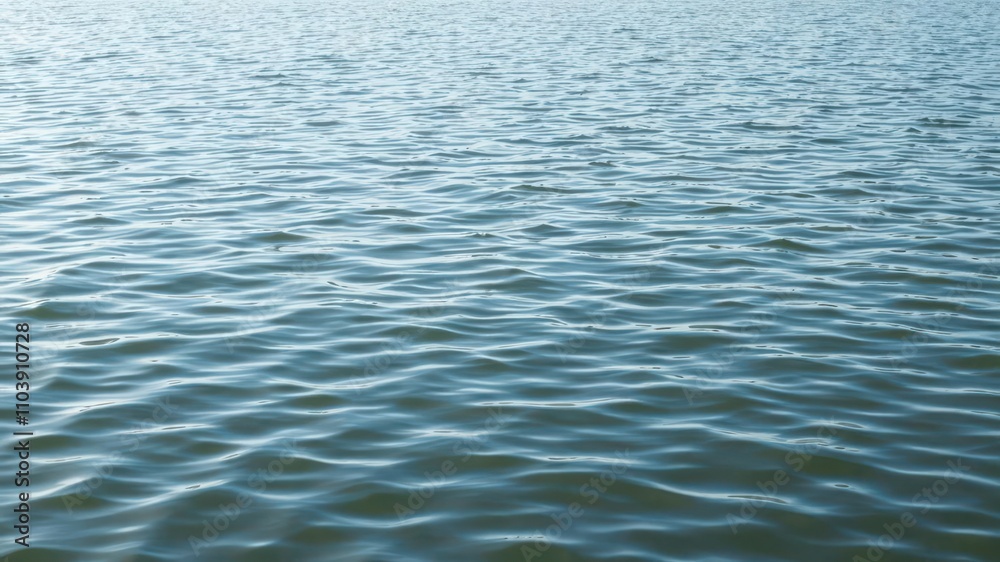Ripples of water on a tranquil lake surface, reflection, peaceful Ripples of water on a tranquil lake surface, reflection, peaceful