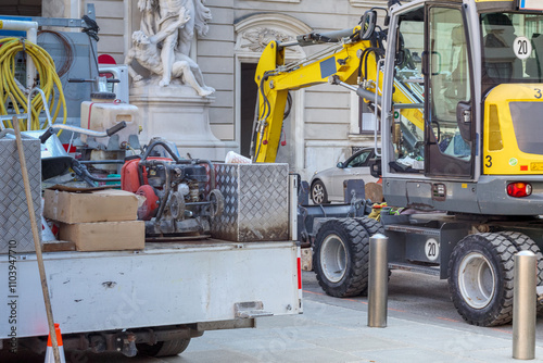 
Repair work on the city street with a forklift and other work equipment photo