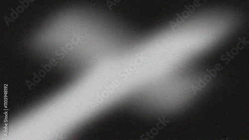 Foto A blurred monochromatic image featuring a glowing cross shape against a dark background with a grainy texture