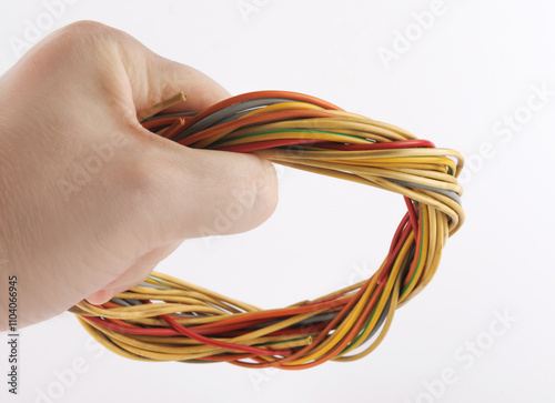 Close-up of multi-core cables woven into a circle on a white background. photo