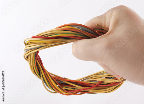 Close-up of multi-core cables woven into a circle on a white background. photo