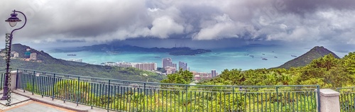 Photography View from Mount Davis showing the passage to Hong Kong harbor, framed by lush gr