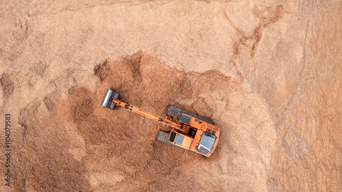 Aerial view road motor grader flatting dirt road surface, Motor grader road construction grader industrial machine construction site new road, Aerial view group excavator working on construction site. photo