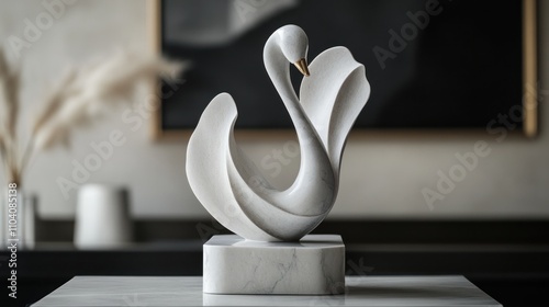 Fototapeta Naklejka Na Ścianę i Meble -  Elegant white marble swan sculpture on a stand.
