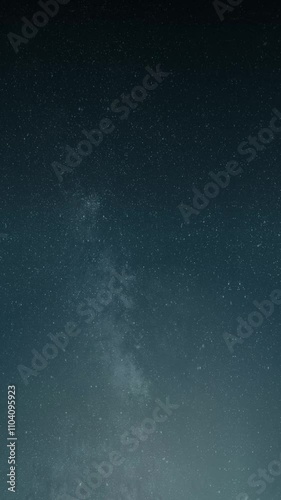 Starry night sky with milky way galaxy vertical looping animation abstract background
