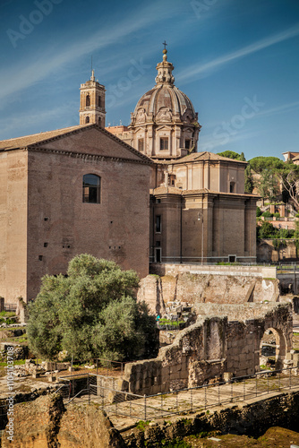 The Roman Forum also known by its Latin name Forum Romanum, is a rectangular forum surrounded by the ruins of several important ancient government buildings at the centre of the city of Rome. Italy photo