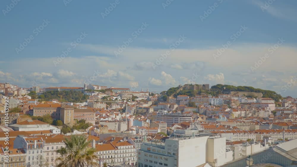 Europe fall in Lisbon, Portugal - panoramic view of the city with traditional buildings and trees against a blue sky. Europe fall in Lisbon, Portugal - panoramic view of the city with traditional buildings and trees against a blue sky.