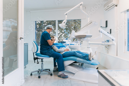 Patient receiving dental care in modern clinic with dentist