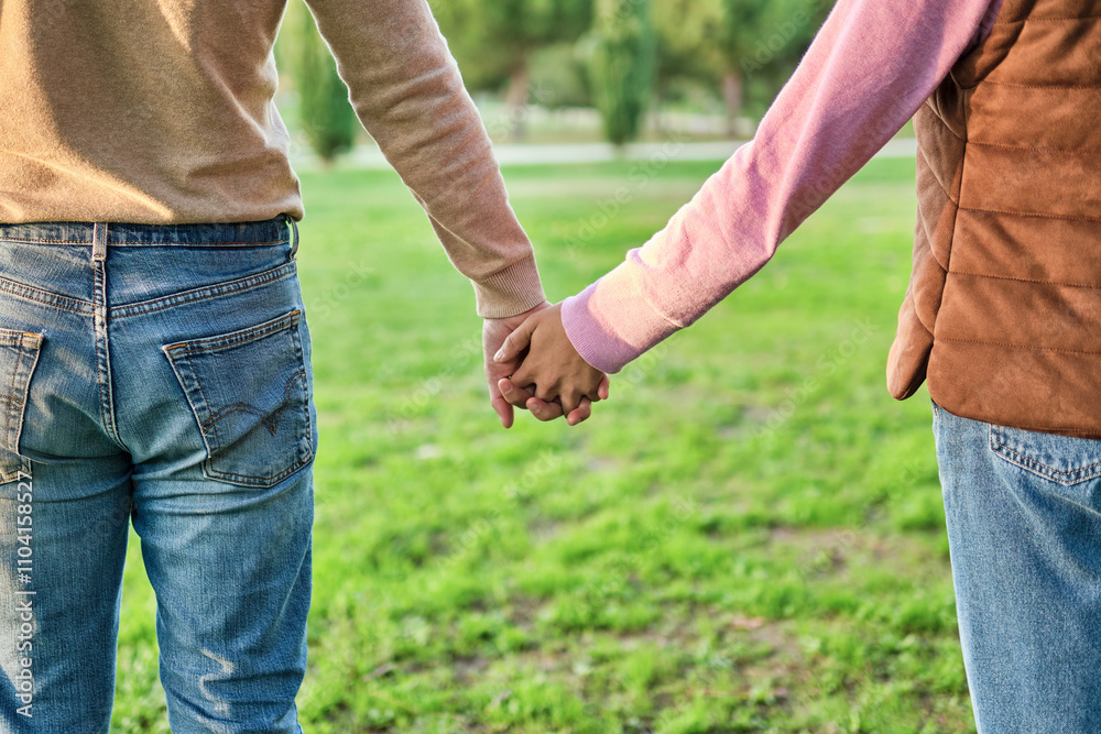 Couple Holding Hands in a Park, Symbolizing Love and Support