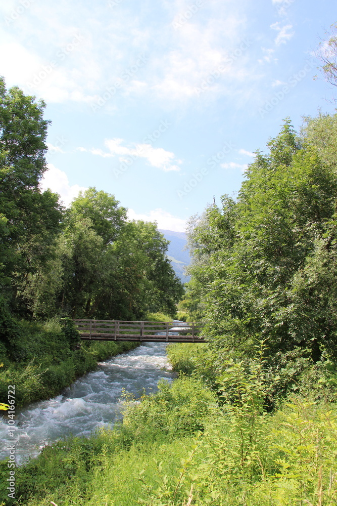 Wooden Bridge over the wild River Etsch close to Glurns - Cycling the transalpine route Via Claudia Augusta Wooden Bridge over the wild River Etsch close to Glurns - Cycling the transalpine route Via Claudia Augusta
