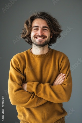 Portrait of a happy man with his arms crossed, suitable for personal or professional use