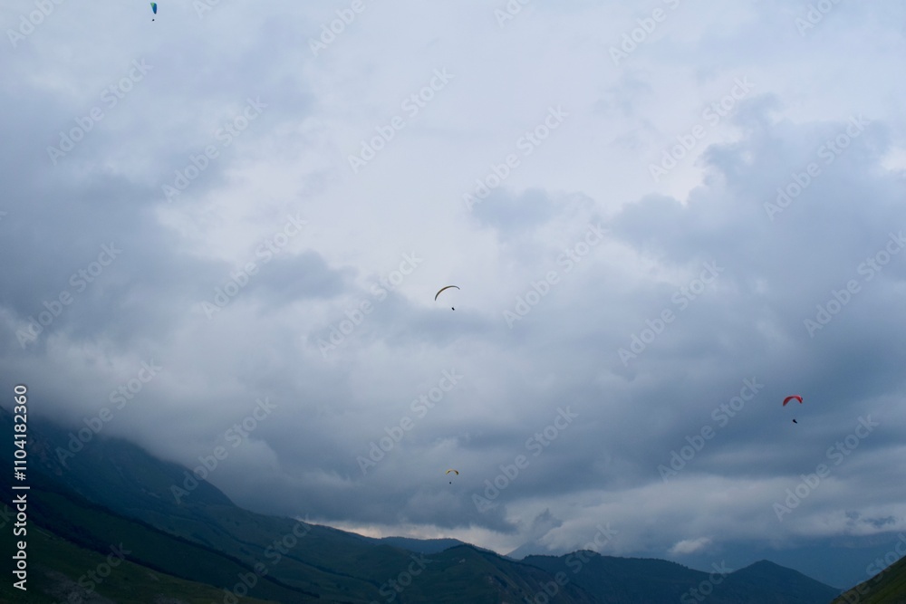 paraglider over the mountains paraglider over the mountains