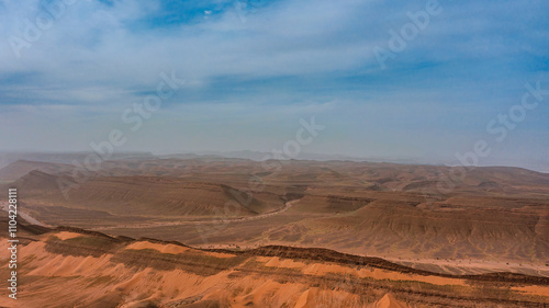 Moroccan Sahara Desert, ancient black volcanic mountains, the Sahara River Oued Ghris, stunning Acacia trees, wild camels, and desert camp, landscape where golden sand dunes merge with green plants