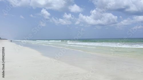 Tropical white beaches with palm trees and azure water of Salalah in 2024